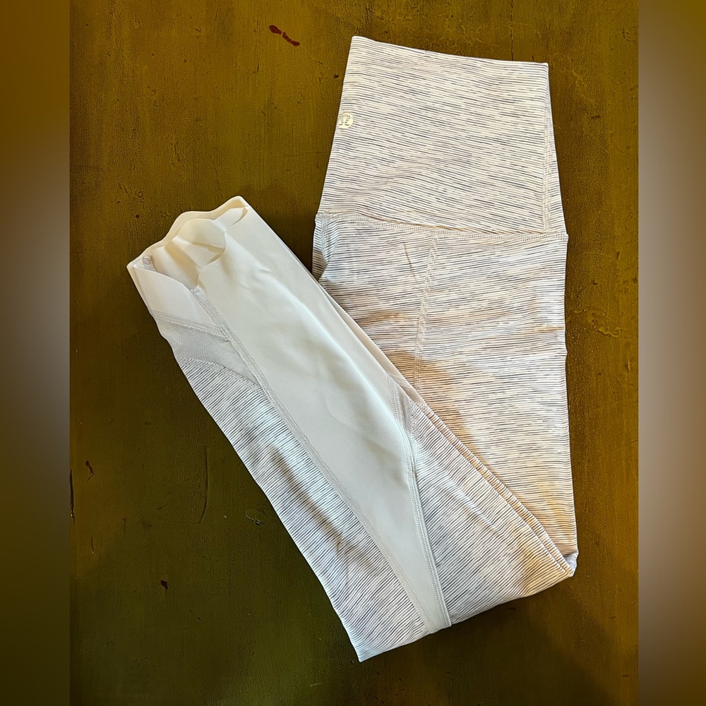 Size 6 white lululemon leggings. Never worn!